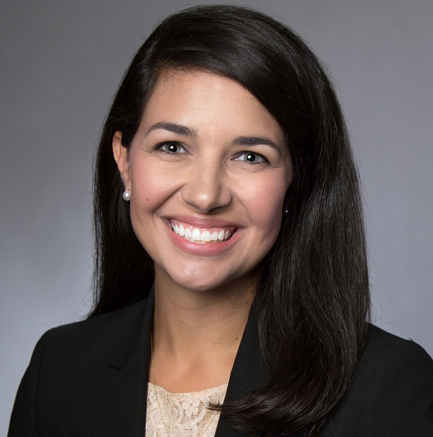 Erica Stem, a female DBA student, smiling for a professional headshot photo.